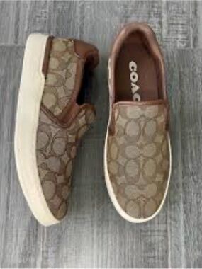 Coach women’s Brown Signature Slip-On Sneakers